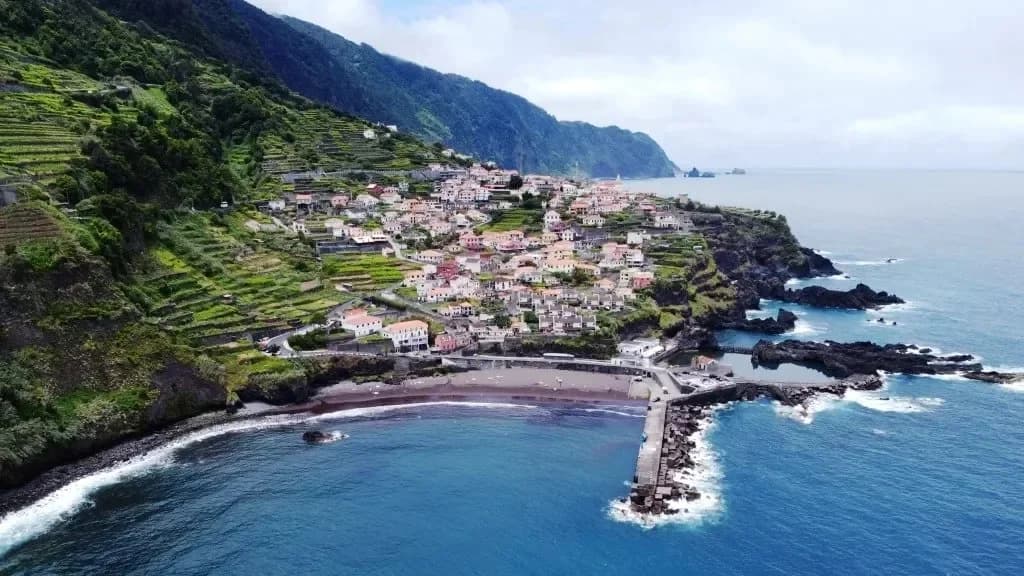 Black-sand beach and cliffs at Seixal