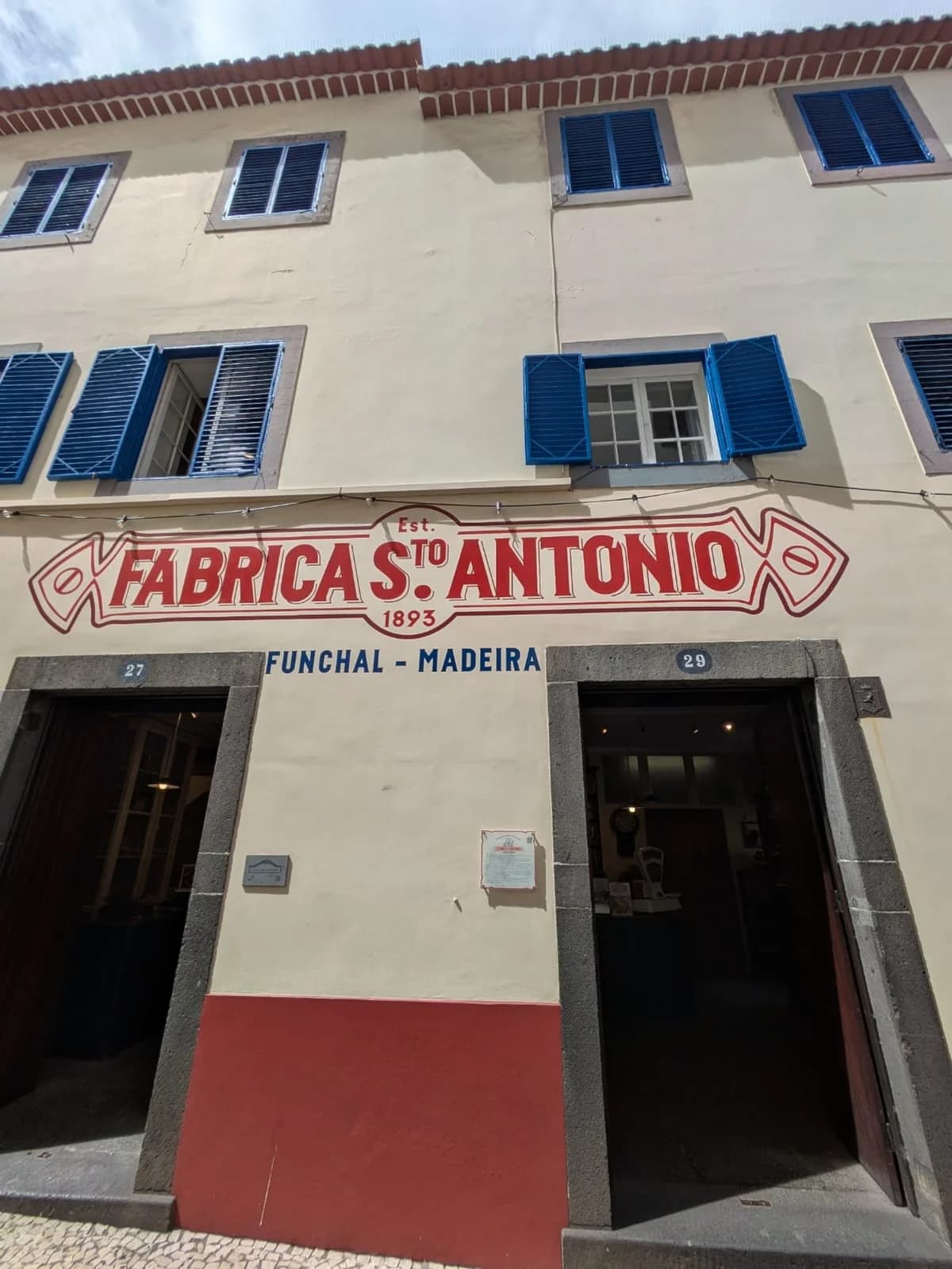 Exterior of Fábrica Santo António bakery in Funchal, Madeira, famous for traditional biscuits and local delicacies since 1893.